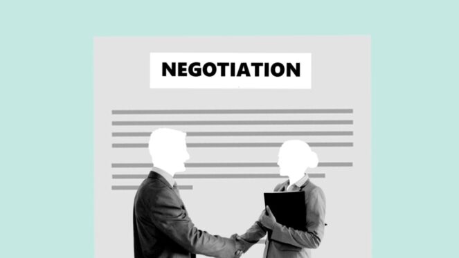 Negotiation, two people shaking hands as successful negotiators