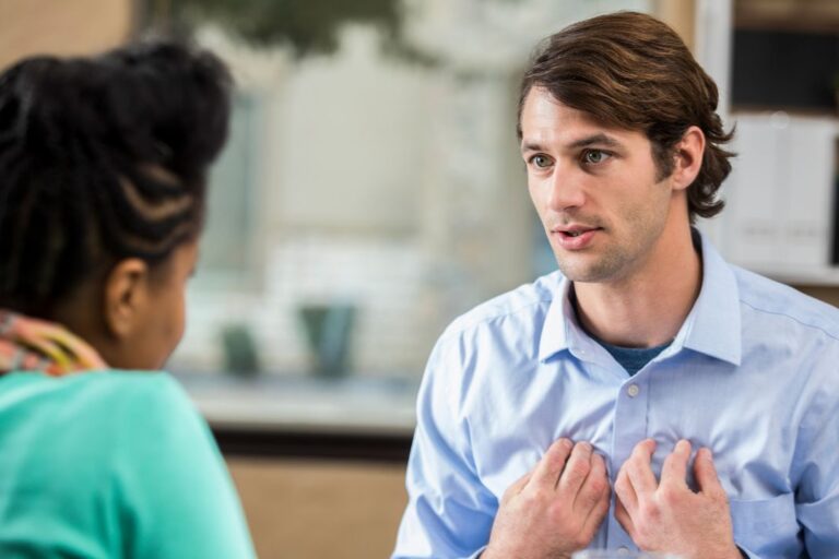 The customer is always vulnerable, man pointing to chest with emotional vulnerability