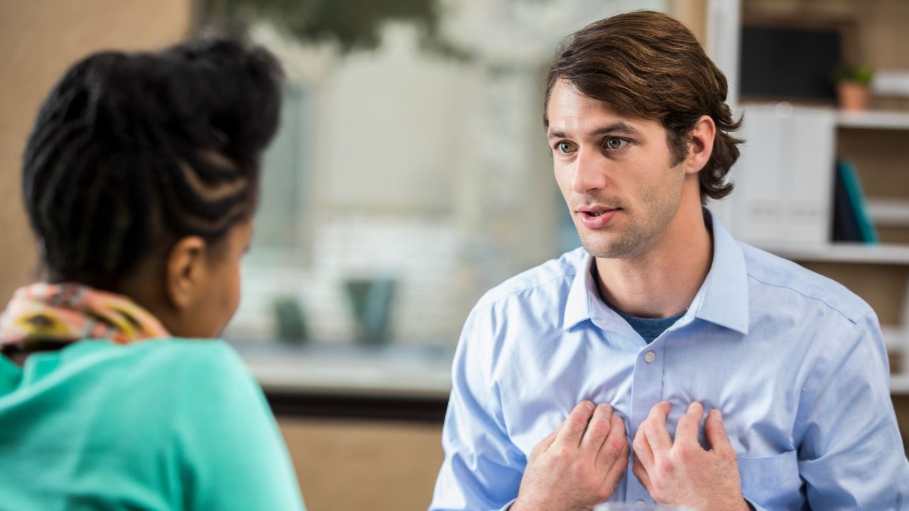The customer is always vulnerable, man pointing to chest with emotional vulnerability