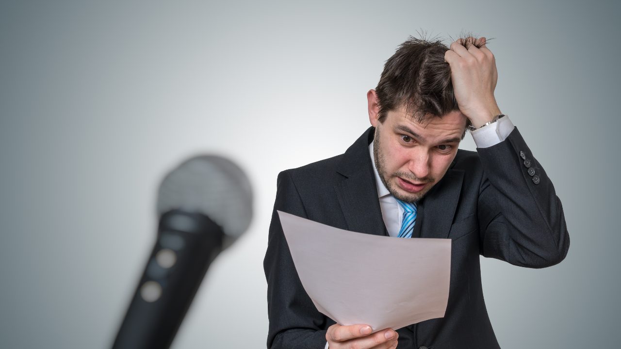 Man with fear of public speaking spins out in front of microphone