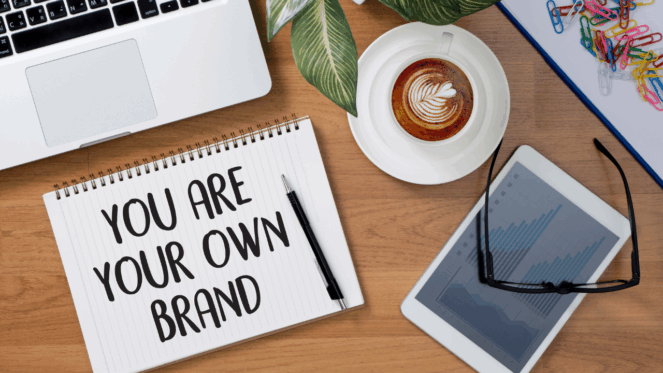 You are your own personal brand written on a notebook on someones desk