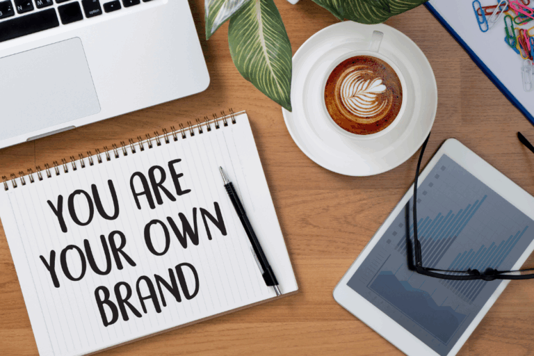 You are your own personal brand written on a notebook on someones desk