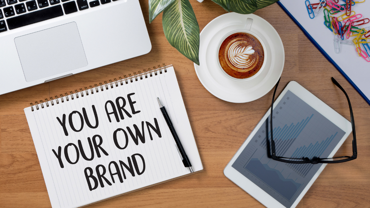 You are your own personal brand written on a notebook on someones desk