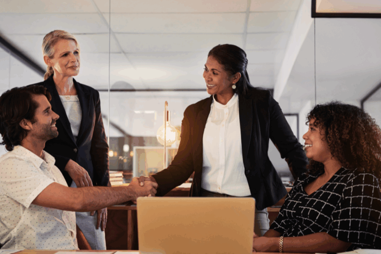 Client relationship a man and woman shake hands in a business setting